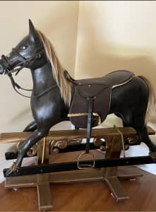 Antique rocking horse.big special. Price dropHand carved.. 4 feet 