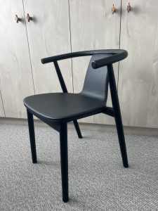 MCM House black dining chairs 
