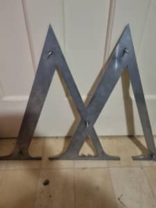 Stainless steel letter m signe