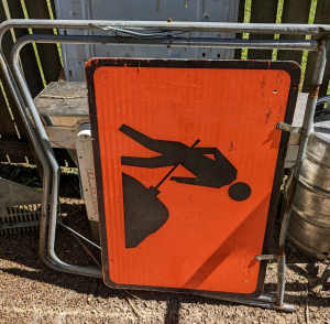 Workers ahead swing sign.