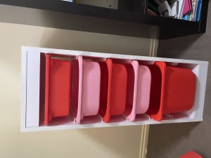 Two White storage shelves with pull out trays for toys
