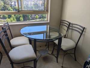 Round glass dining table with 4 chairs