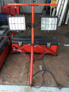 FLOOD LIGHTS. WITH ADJUSTABLE STAND AND STORAGE CASE.AS NEW.