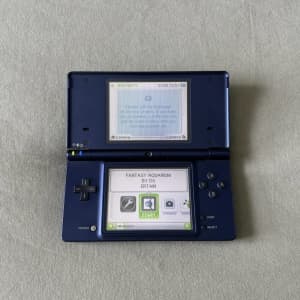 Nintendo DSi with 13 games and charger