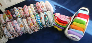 38 Cloth nappies with inserts plus spare inserts
