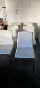 8 white leather chairs