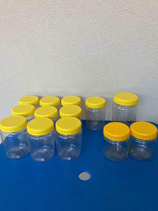 Plastic & glass jars with lids -all for various uses.