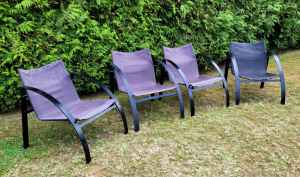 4 x black fabric backed lounge chairs