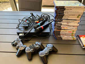 PS 2 SINGSTAR WITH MICROPHONES AND GAMES AND CONTROLLERS