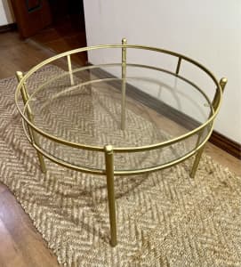 Gold metal and glass round coffee table retro style. Details below