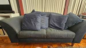 2 seater navy blue sofa. Needs a fabric clean
