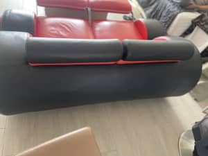 Black and Red leather couch with extendable footrest