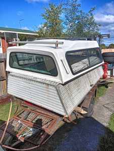 Two ute canopies and old trailer