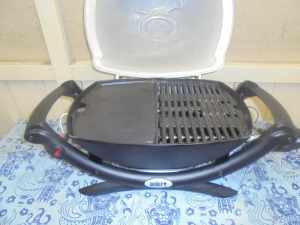 Weber Baby Q1000 2nd generation with breakfast plate. Used twice