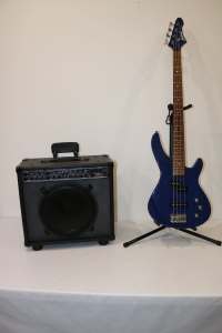 Blue Bass Guitar with a Large Speaker Amplifier