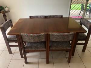 Extendable dining table with six chairs