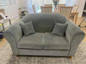 2 seater lounge with matching square cushions