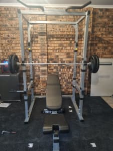 Power squat rack with bar, bench and 100 kgs of weights 