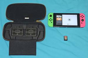 Nintendo Switch Console & Joysticks with Splatoon 2 and Zelda case