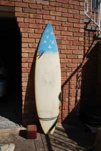 Surfboard, three fin, good condition, with leg rope.