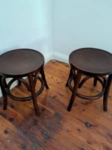 Two round wooden low stools