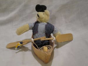 Sailor bear in a boat