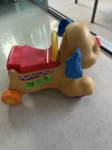 Fisher Price Laugh and Learn stride to ride Puppy. 