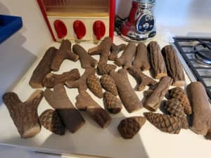 Artificial ceramic logs and pinecones
