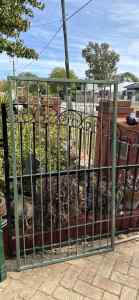 Green steel garden gate