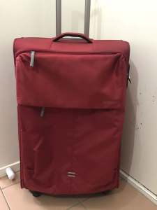 Four wheels American Tourister large suitcase
