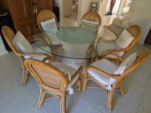 Round dining table with 6 cane chairs