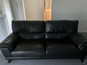 Three seater black leather couch