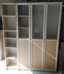 Ikea three piece wall storage unit with glass doors