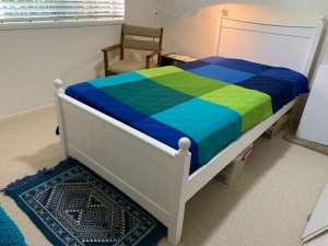 King single white timber bed. Good slat base and inner spring mattress