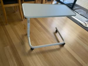 Over bed/chair table - height adjustable with wheels