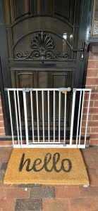 White metal safety gate with 2 small extensions