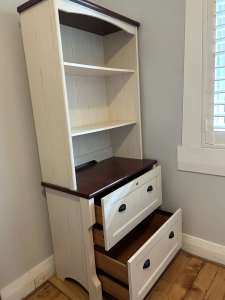 Brown and white bookcase. Solid and well built. Almost new condition.
