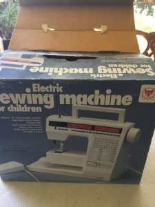 Vintage electric sewing machine for children