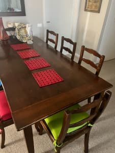 custom made wooden table with 8 chairs
