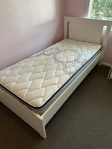 White single bed frame with mattress