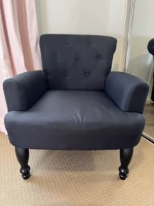 Childrens black upholstered chair 