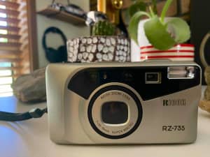 Ricoh RX-735 vintage 35mm film point and shoot camera.