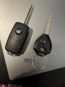 car key. One original toyota , one remade .