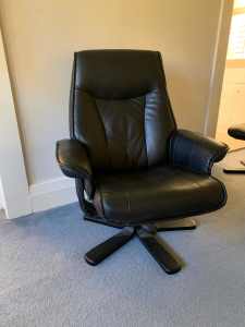 Black leather recliner chair and matching foot stool