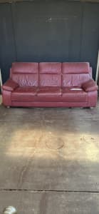 Three seater red leather couch