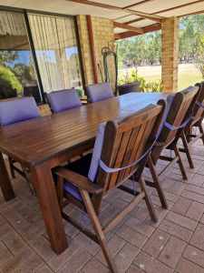 Outdoor wooden table with 6 chairs.
