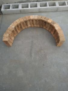Bricks, old frog bricks cut for arch construction - pizza oven