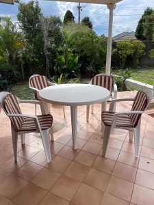 Outdoor plastic dining set with cushions and 4 chairs