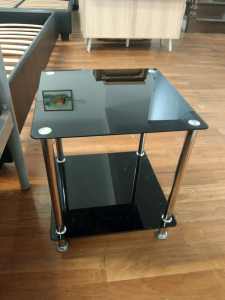 Small black glass bedside table with good quality
