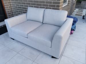 BRAND NEW 2 seater stone grey fabric sofa